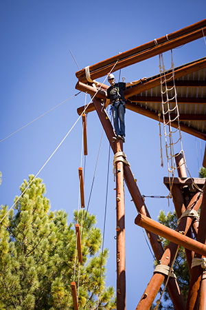 Zack Holm on top of a wood tower at Sierra Nevada Journeys.