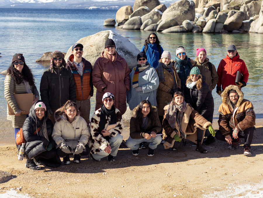 MFA students gather on the beach at Lake Tahoe.
