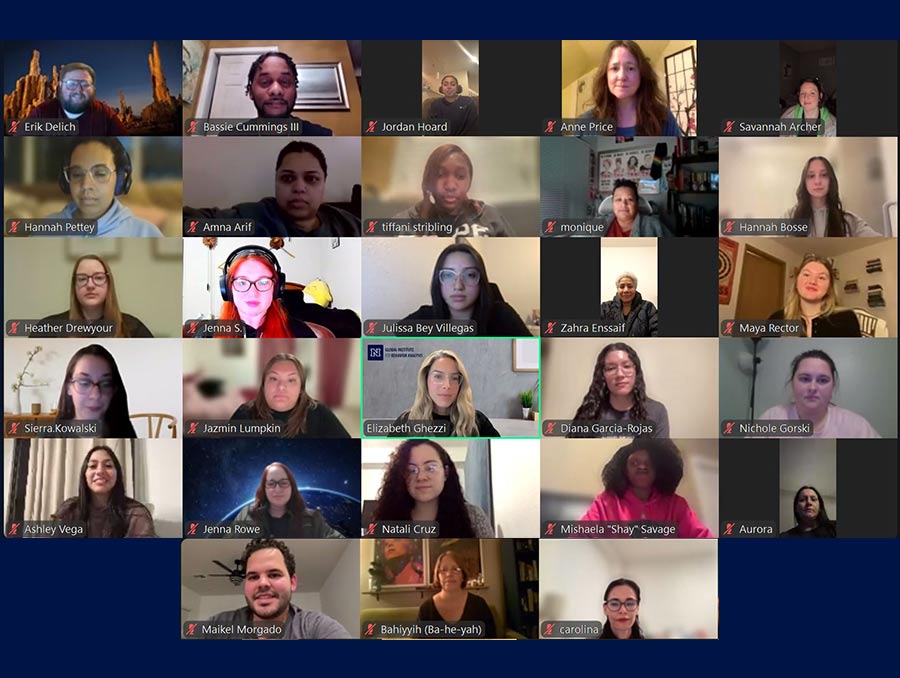 A screengrab of a Zoom meeting with 23 people in the meeting on a navy blue background.