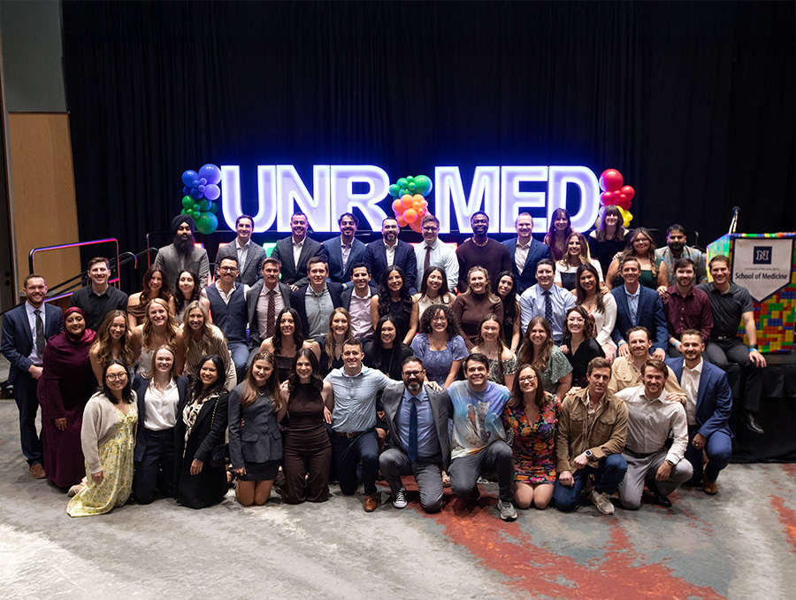 Group photo of the class of 2026 during a LEGO-themed match day event.