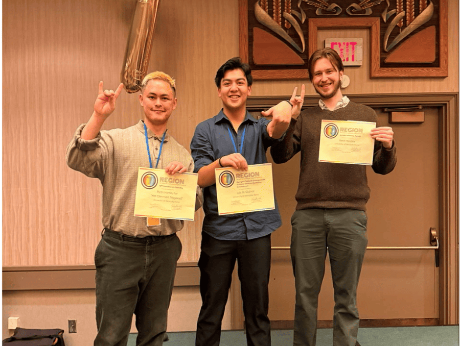 The students holding awards. 