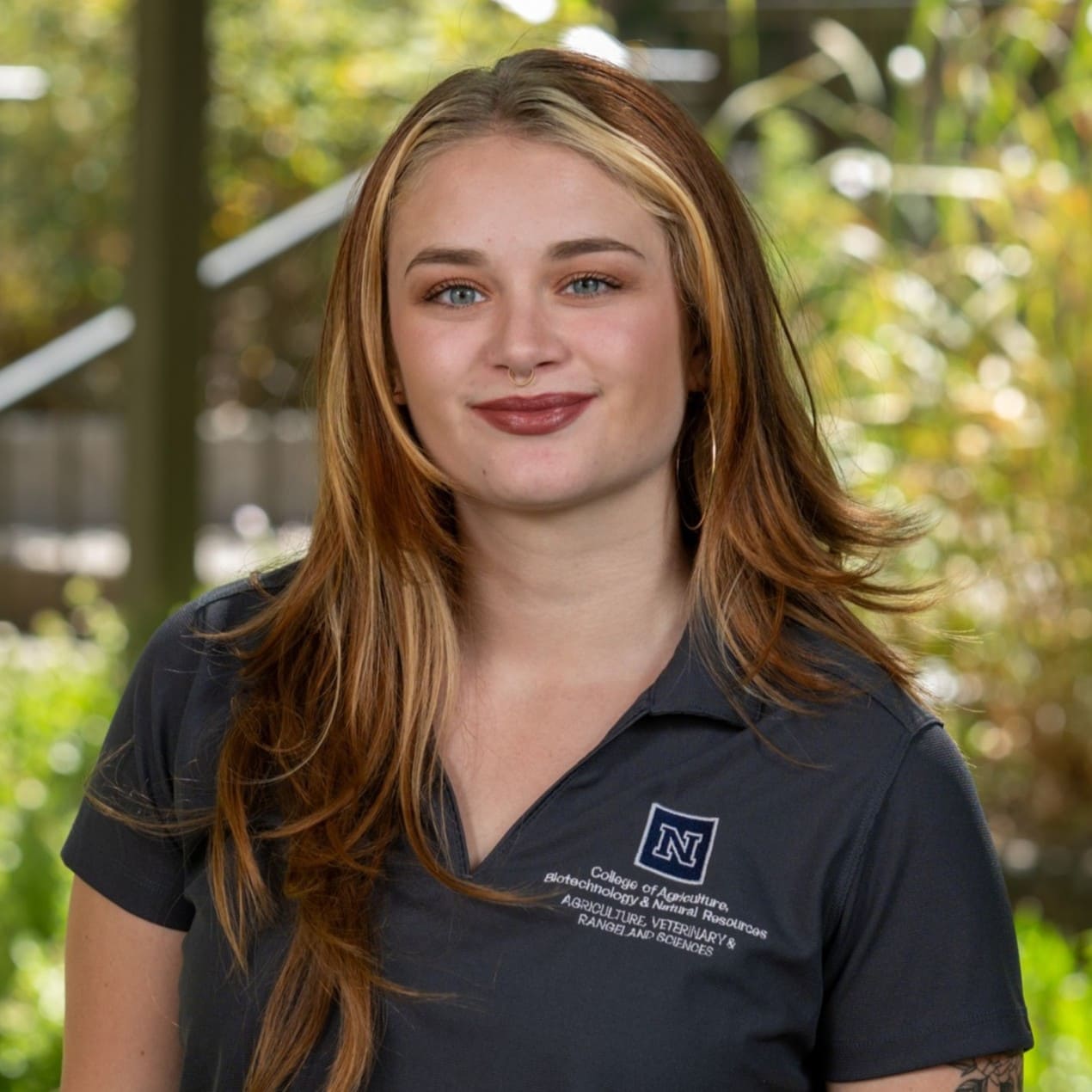 A headshot of Anna Moss.