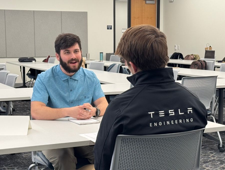 A student conducting a mock interview.