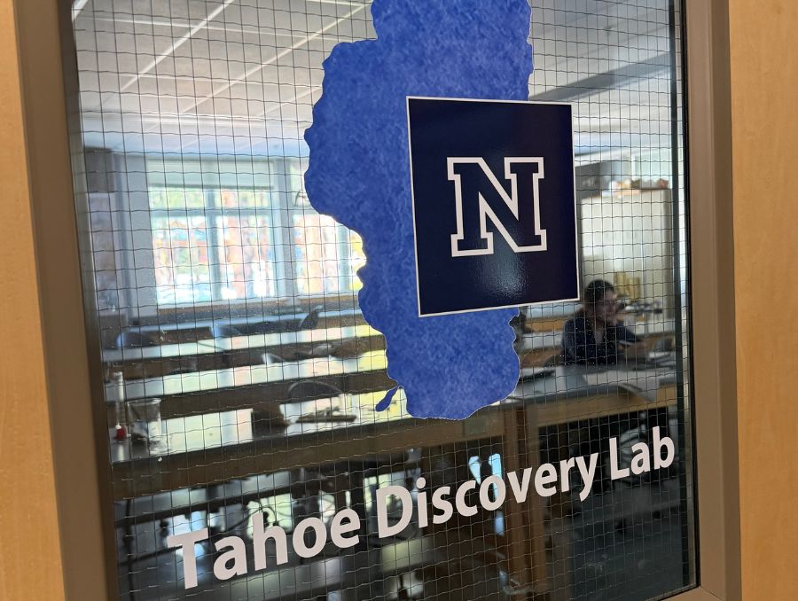 A classroom window at the University of Reno, at Lake Tahoe campus with a Lake Tahoe logo, that reads Tahoe Discovery Lab.