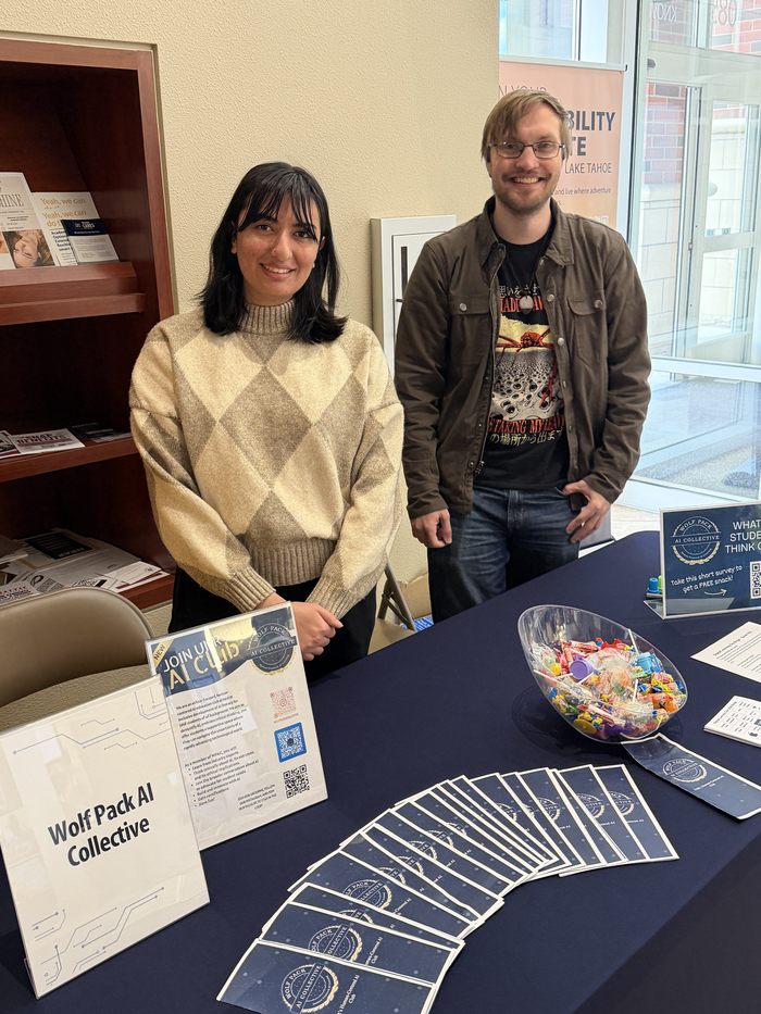 Leaders of the WolfPack AI Collective tabling with information.
