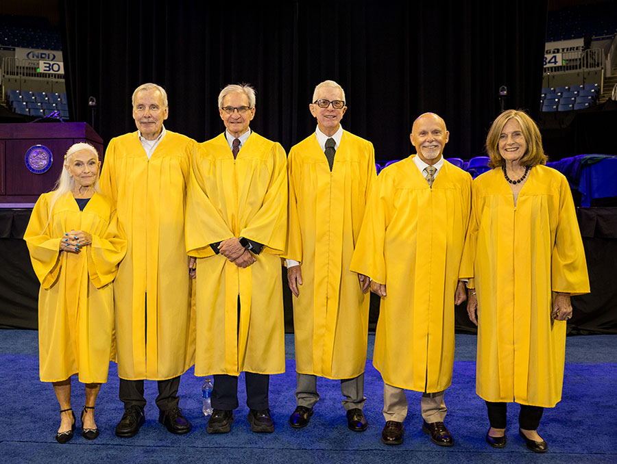 The UNR Med M.D. Class of 1976 graduates dressed in their 50th reunion golden regalia.