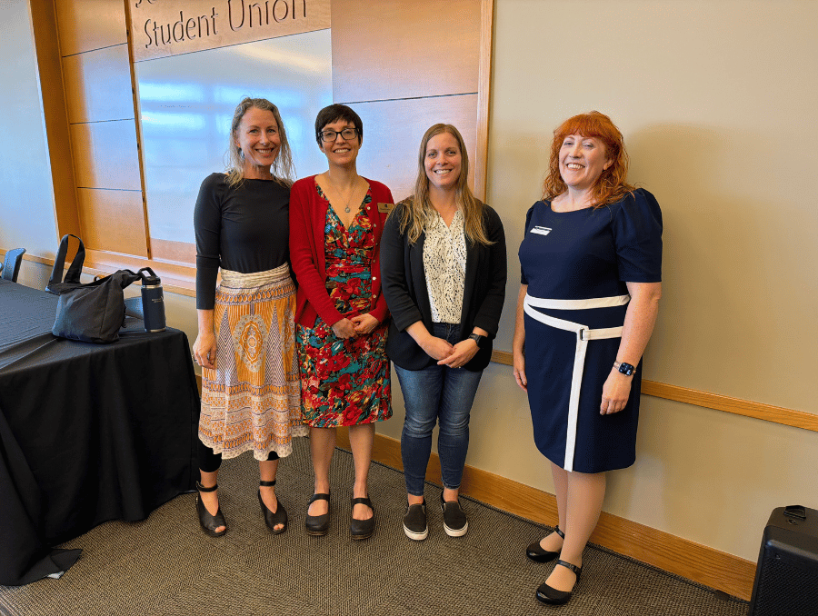 Faculty members gather after an ai event.