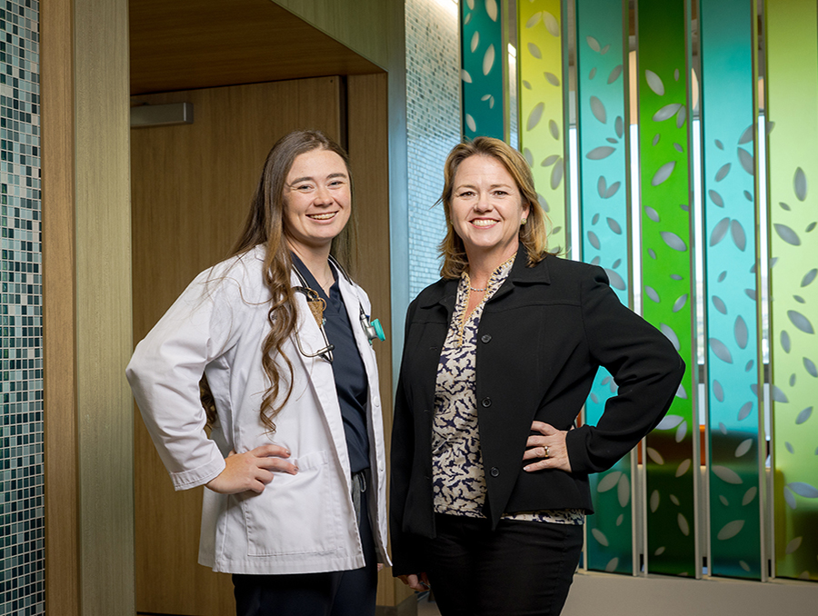 Bailey Ivory and Kristina Deeter, M.D., standing in a hallway at Renown Regional Medical Center.