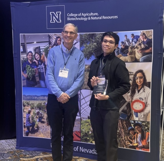Professor Bob Ryan and Brandon Veron pose for a picture. 