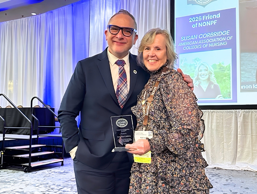 Dean Charles Yingling and Kathleen Carroll. Kathleen is holding her award.