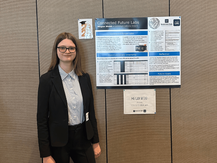 Megan Webb in front of a poster titled, "Connected Future Labs."