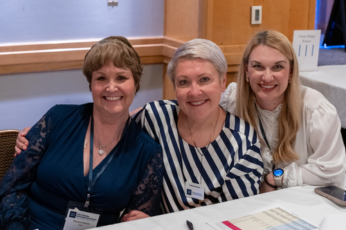 Event organizers Denise Haynie, Tatiana Goeum and Viktoriia Ostrova pose for a picture. 