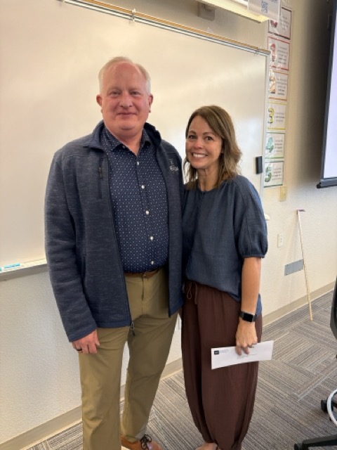 professor and provost stand together