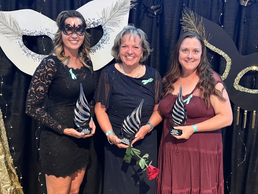 Three nursing faculty members with their awards.