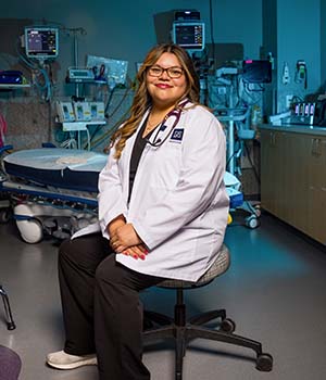 Zoee Castro wearing a white coat.