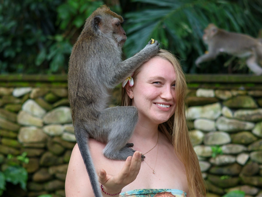 Alex Couraud with a monkey on her shoulder. 