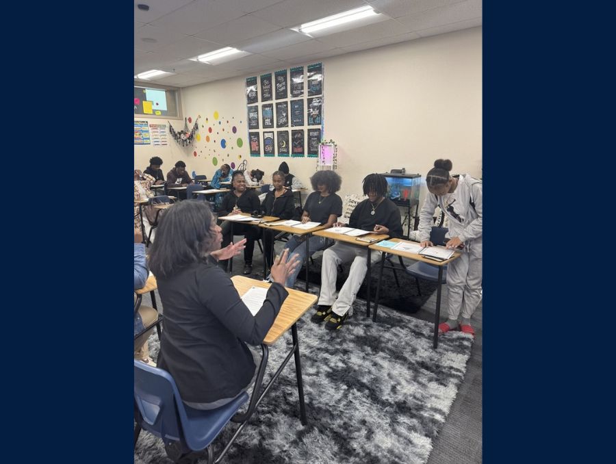 A group of teenagers in a classroom setting. 