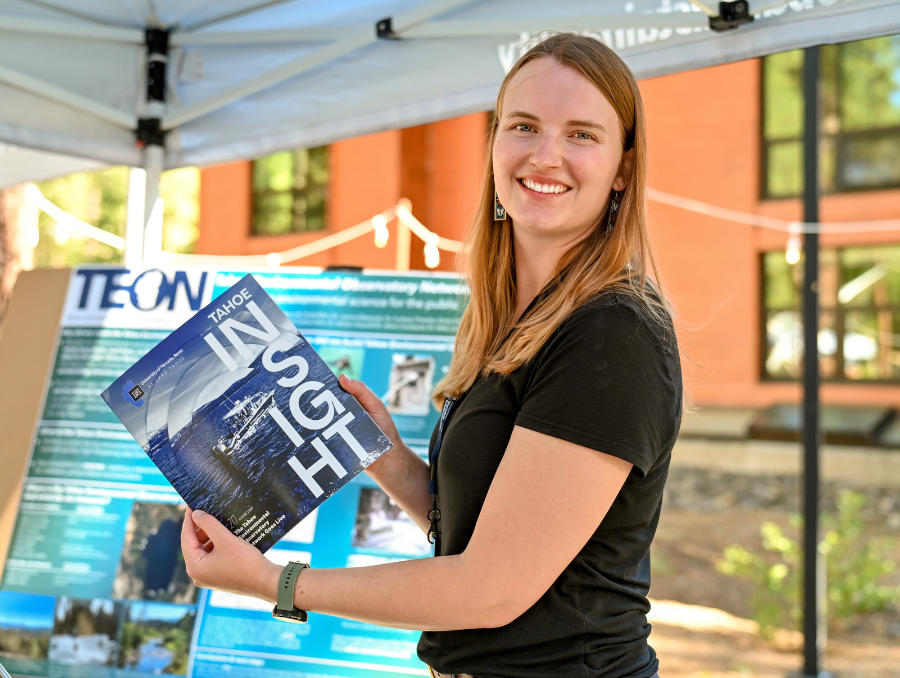 Kylie Papson holds magazine on Lake Tahoe campus. 