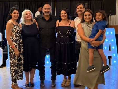 Luisa Lucero celebrates with members of her family at a party.