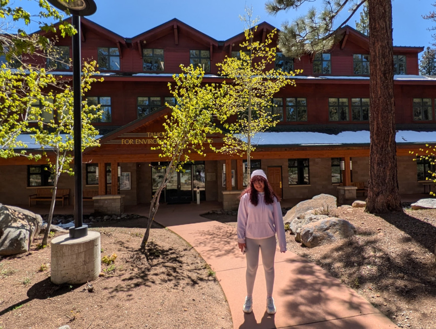 Selvi stands near building on the University's Lake Tahoe campus.