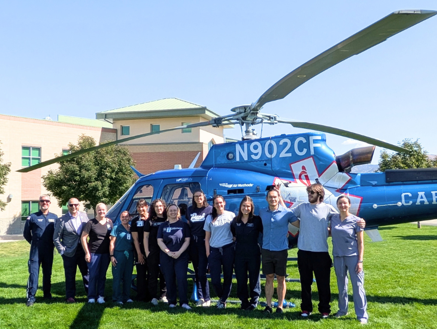 Orvis School of Nursing Faculty and REMSA Flight Crew in front of a helicopter