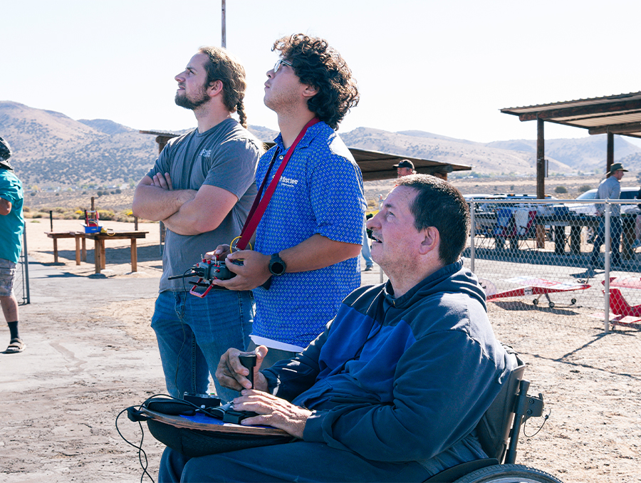 Allen Seals flying a radio-controlled airplane.
