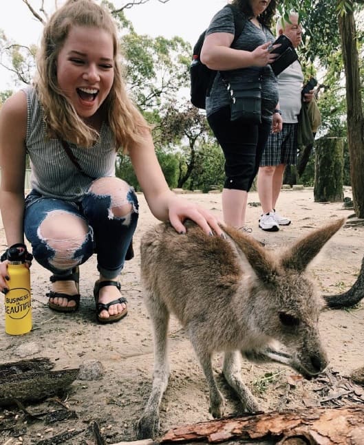 Hannah Hudson with a small kangaroo