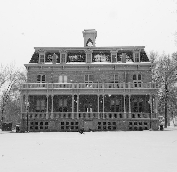 The quad covered in snow, Morrill Hall in the background, taken on an iPhone in black and white.