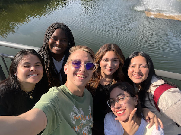 A group of smiling students taking a selfie.