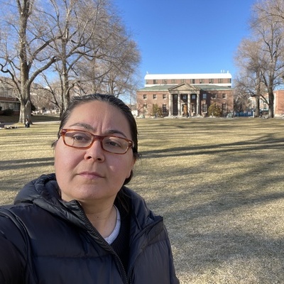 Gunes Kaplan poses with Mackay Science building behind her.