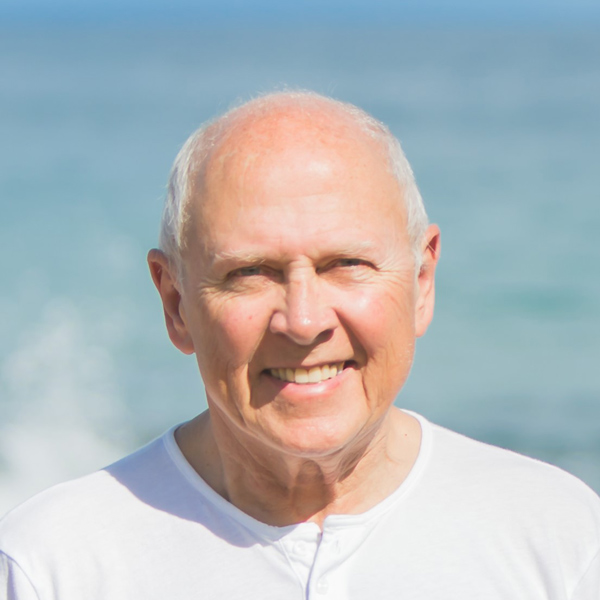 Headshot of Mick Hitchcock in front of water