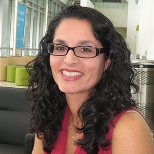 Nicole Jacobs sitting in a lab