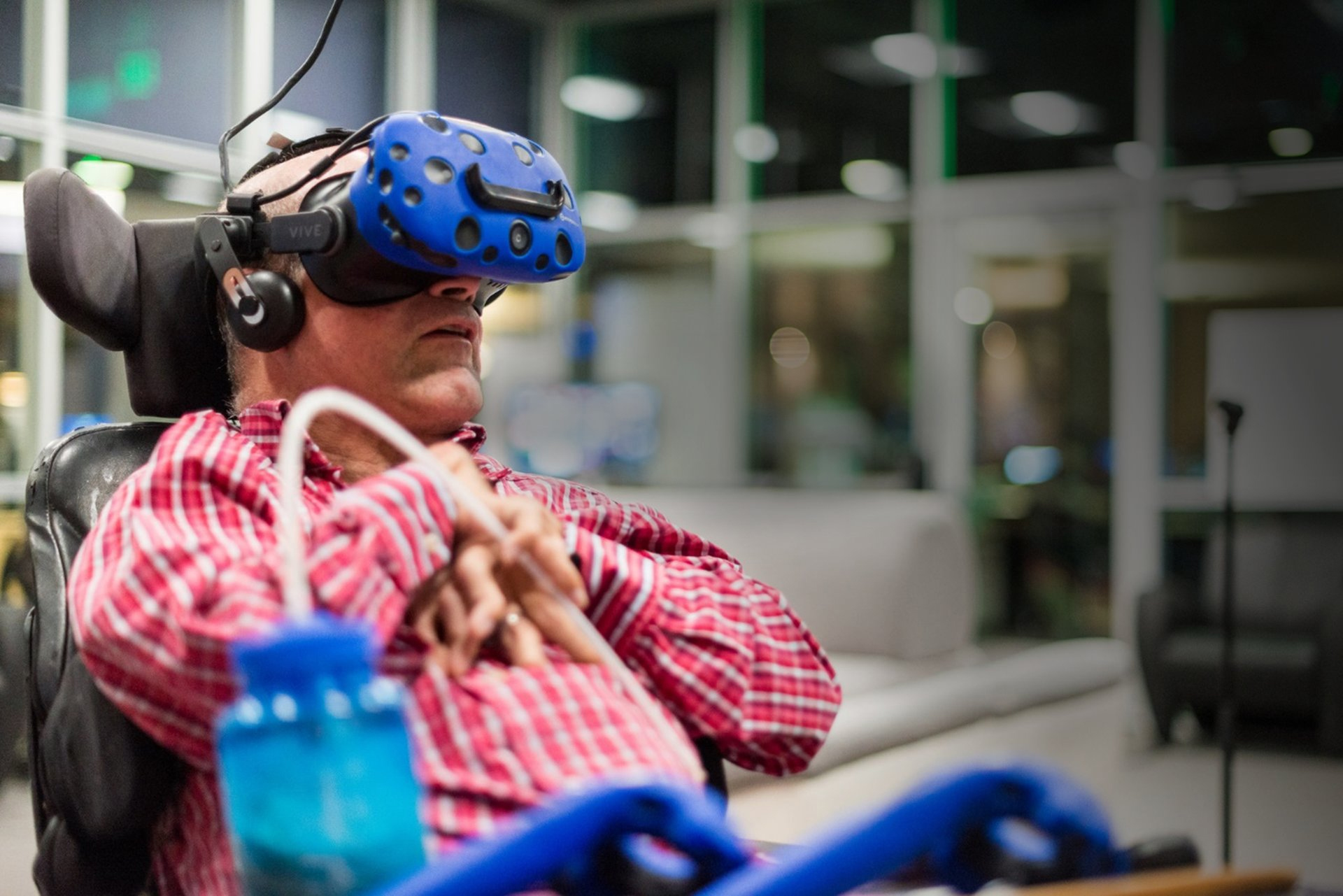 Evan Gadda in his wheelchair with a VR headset on