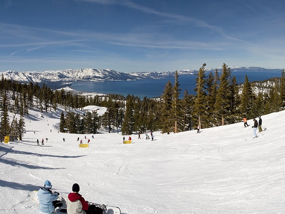 The slopes of a Lake Tahoe ski resort, with Lake Tahoe in the background