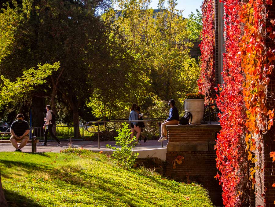 Students outside Frandsen Humanities on a sunny fall day