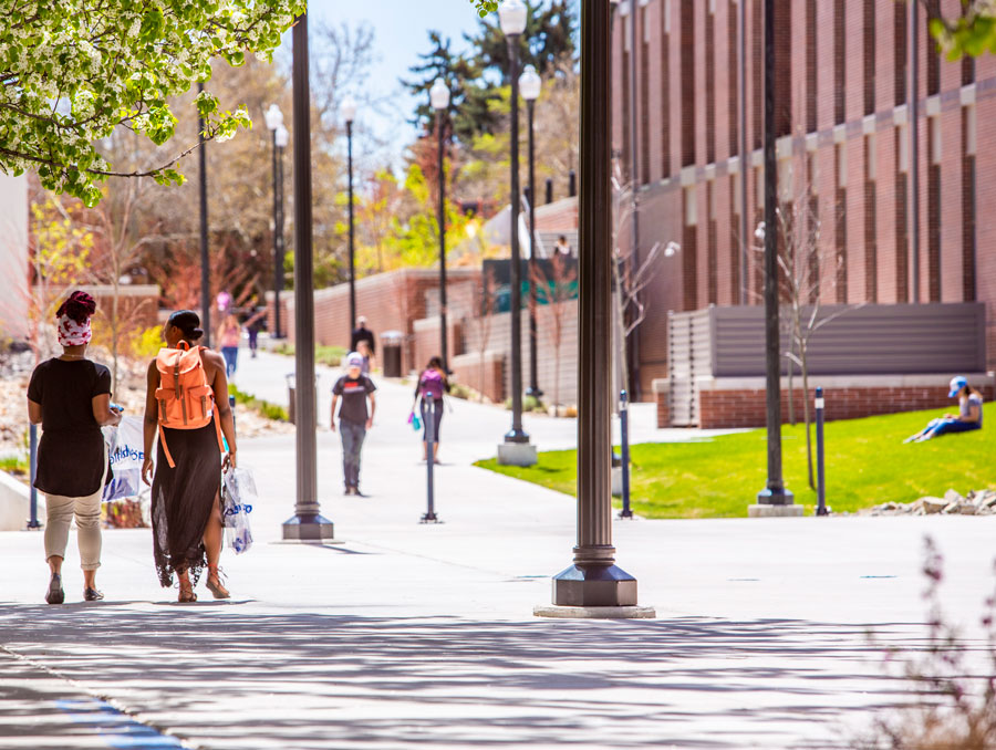 Students walking on the University of Nevada, Reno campus on a warm, sunny day