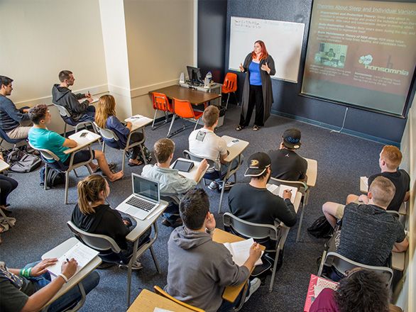 Students in a classroom listening to a lecture