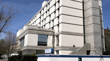 Exterior of Sierra Hall, a white, multi-story residence hall on the campus of the University of Nevada, Reno.