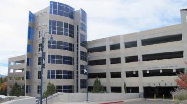 Exterior view of the West Stadium parking facility on the campus of the University of Nevada, Reno, a multi-story parking garage with elevators.